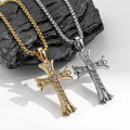Gold-tone and silver-tone Dominion Cross necklaces displayed against dark stone