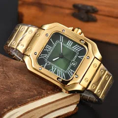 A gold-tone metal watch with a square case, Roman numeral hour markers, and a dark green dial, resting on a vintage leather-bound book.