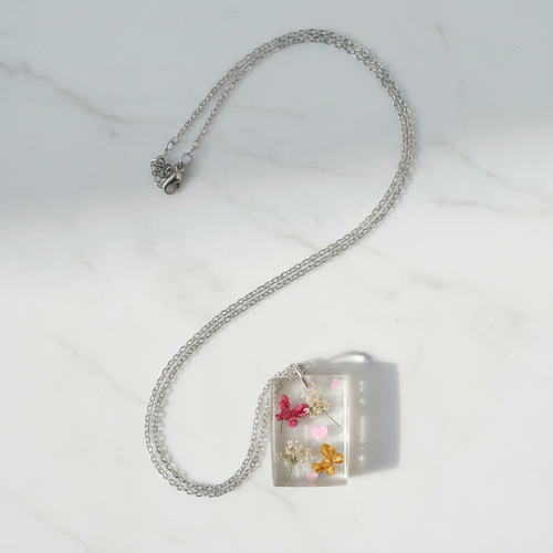 Botanical Resin Necklace on White Marble