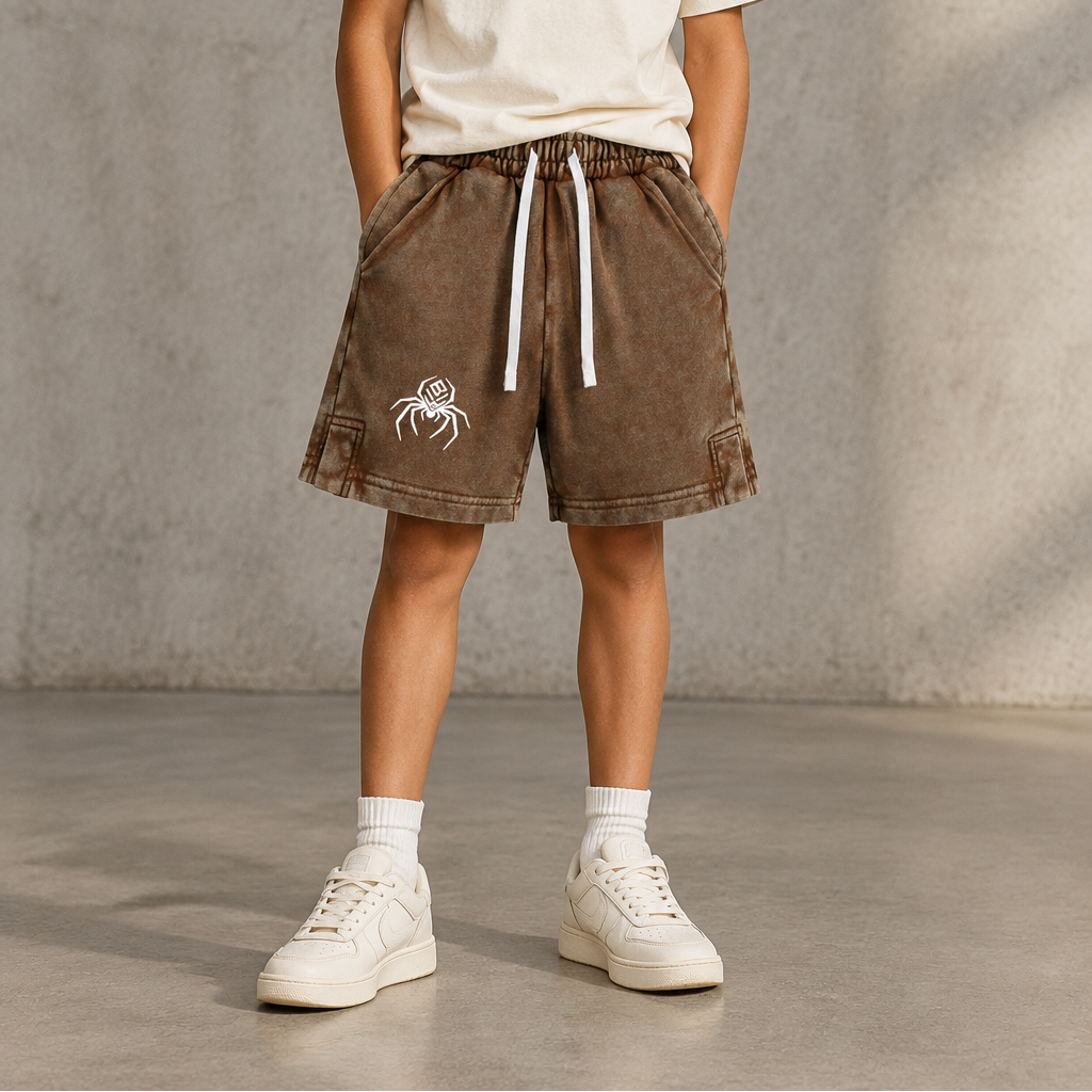 Boy wearing brown snow-washed BlkWidow shorts