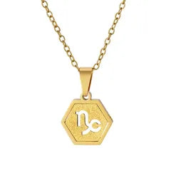 A gold hexagonal pendant necklace featuring a white engraved monogram 'M' and 'C' on a white background.