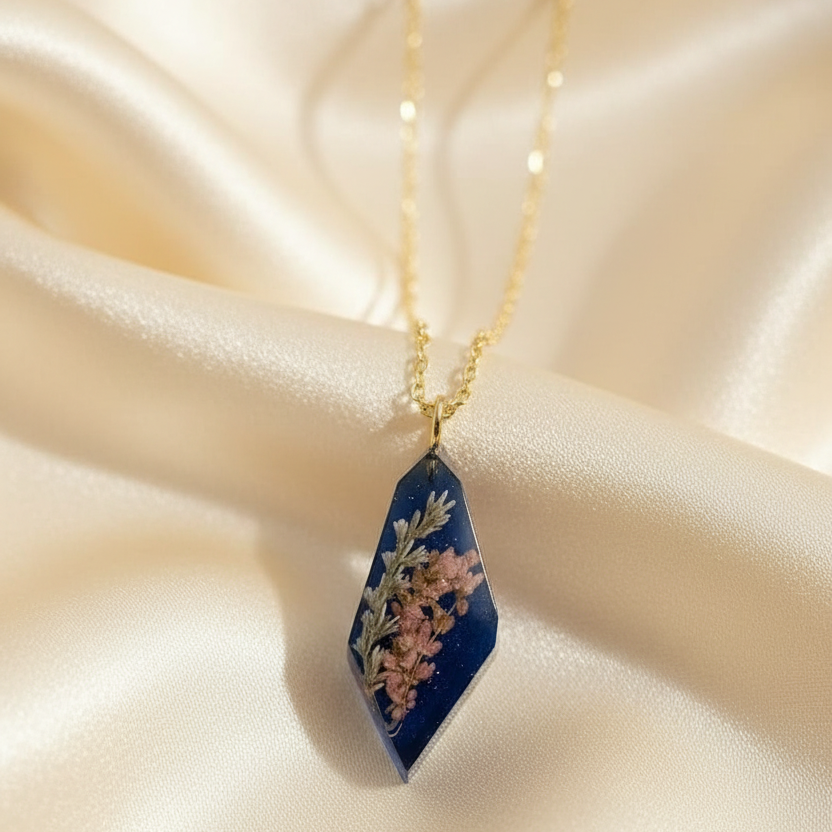 Elongated rhombus translucent navy pendant on cream silk