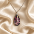 Enchanting Teardrop necklace on cream silk