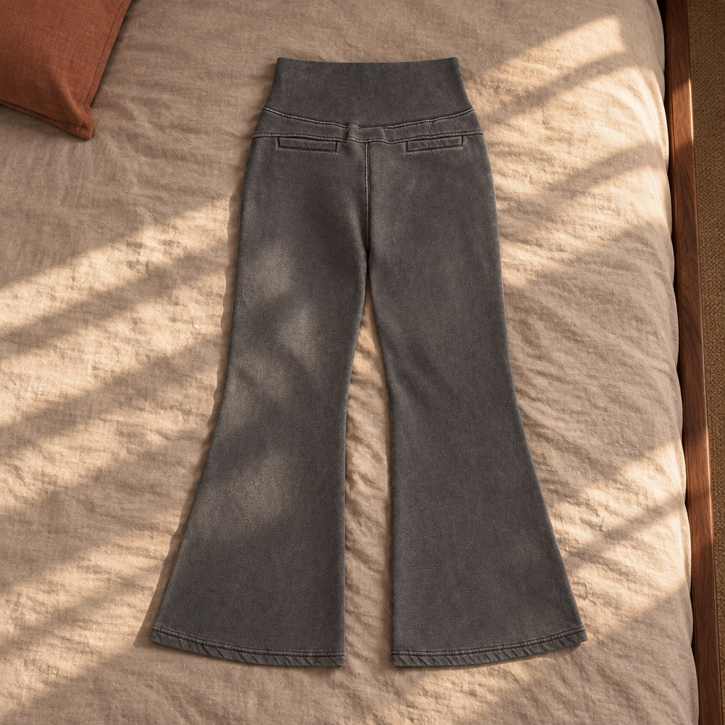 Grey flared fleece pants back on sunlit bedding