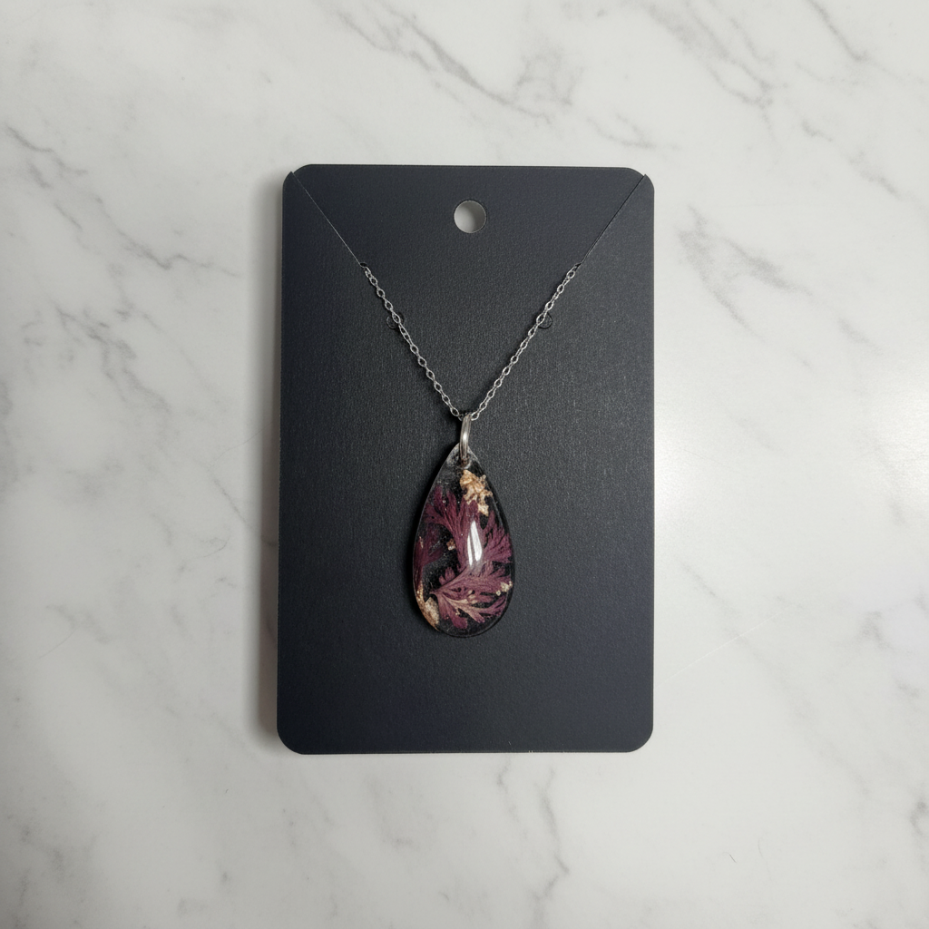 Rare Blue Flower Resin Pendant on marble background