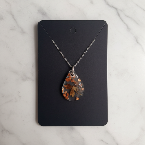 Enchanting Teardrop resin pendant on marble background