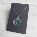 Rare Blue Flower Teardrop on marble background