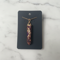3 Butterflies Flower Resin Necklace on marble background