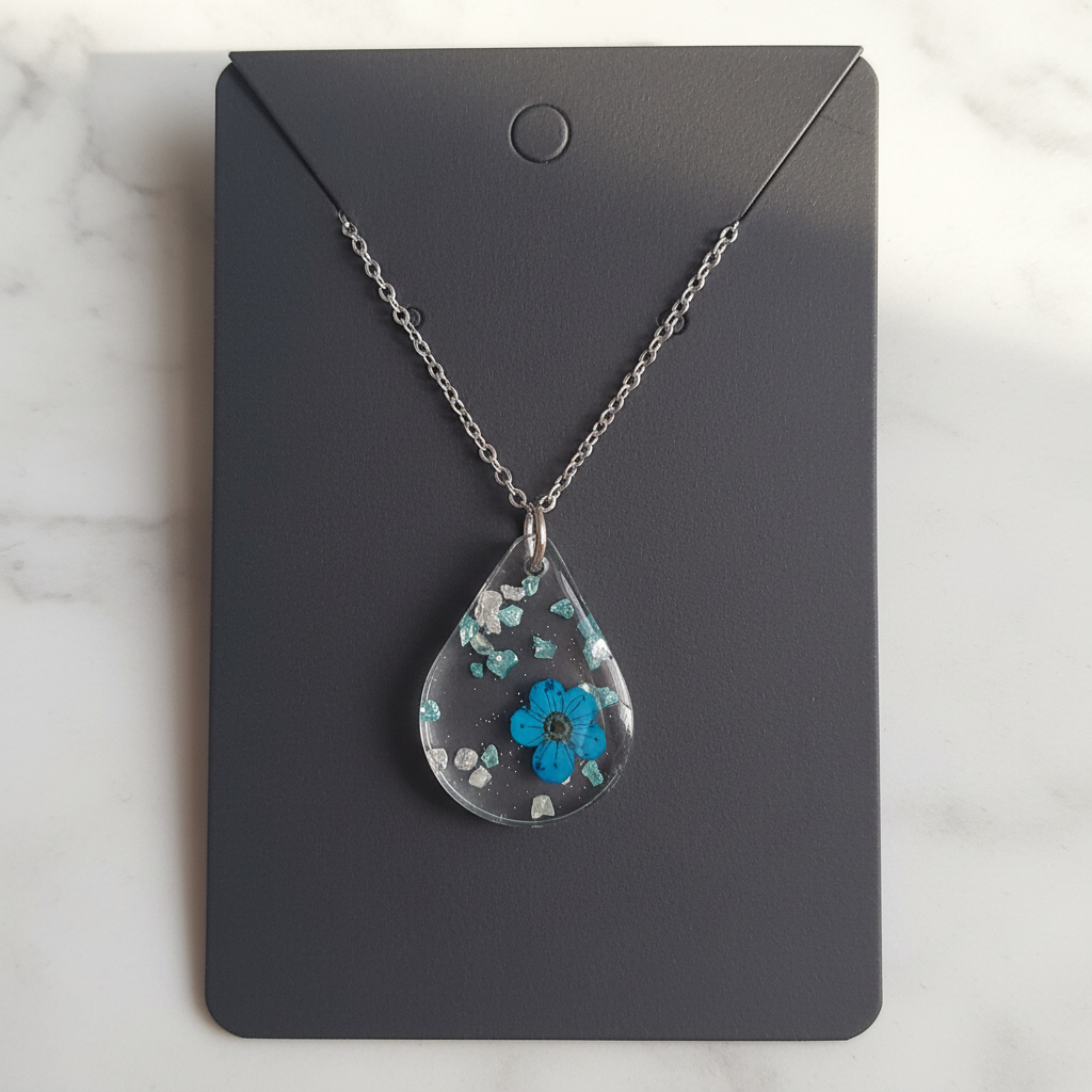 Rare Blue Flower Resin Pendant on marble background