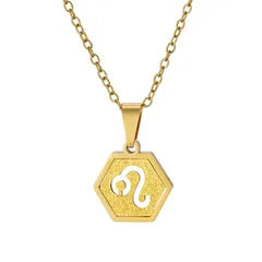 A gold hexagonal pendant necklace featuring an engraved zodiac symbol, shown on a clean white background.