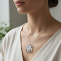 Model wearing resin pendant necklace