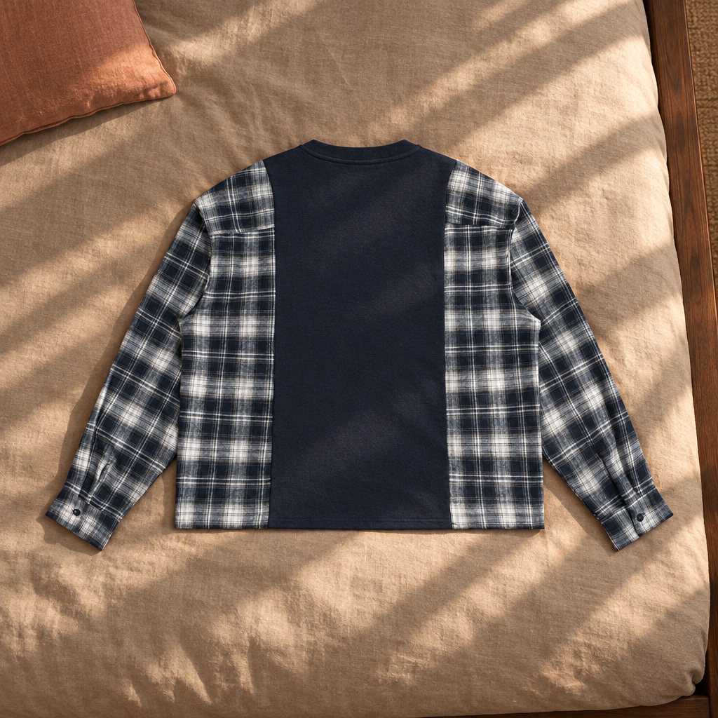 Navy plaid-panel T-shirt back on sunlit bedding