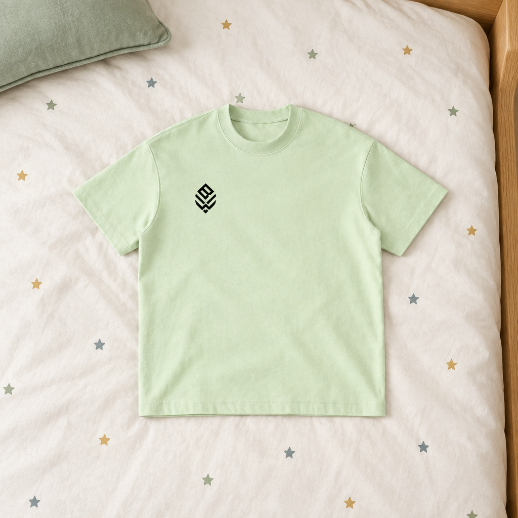 Pale green crewneck front on star bedding