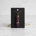 Purple amethyst resin pendant on white marble