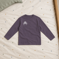 Purple long-sleeve T-shirt front on star bedding