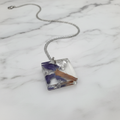 Resin pendant on white marble