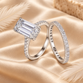 Ring set on cream silk with ivory feathers and travertine styling