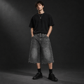 Square editorial model image of the denim shorts