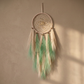 Square hanging-decoration image on a warm taupe background