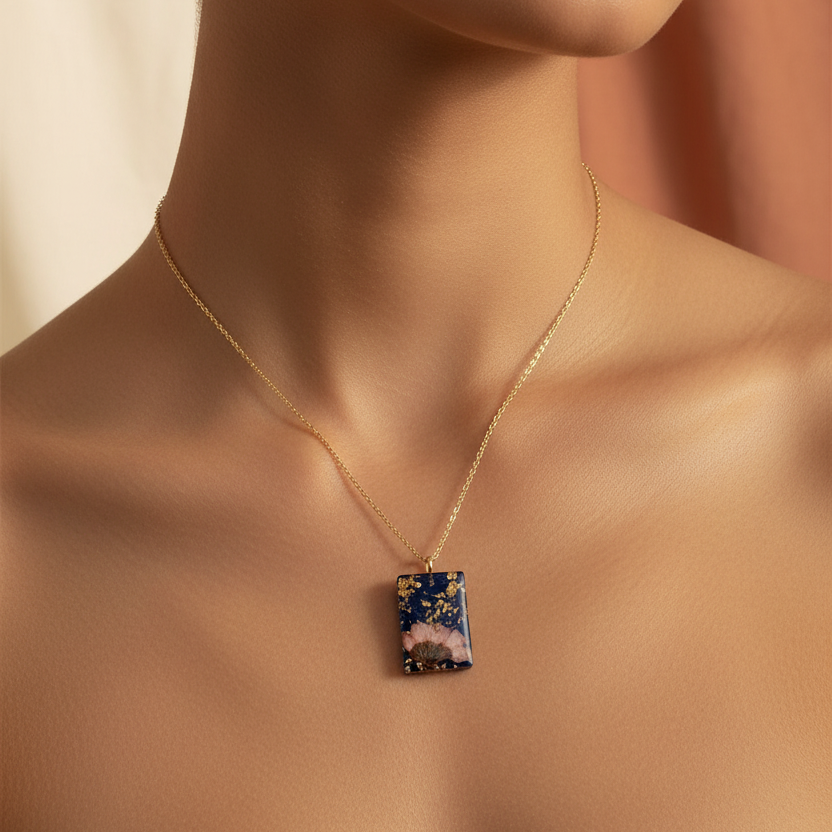 Square navy poppy pendant on model