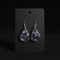 Teardrop resin earrings dark background