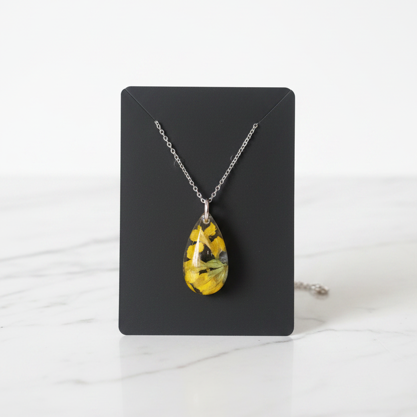 Yellow Teardrop Necklace on White Marble