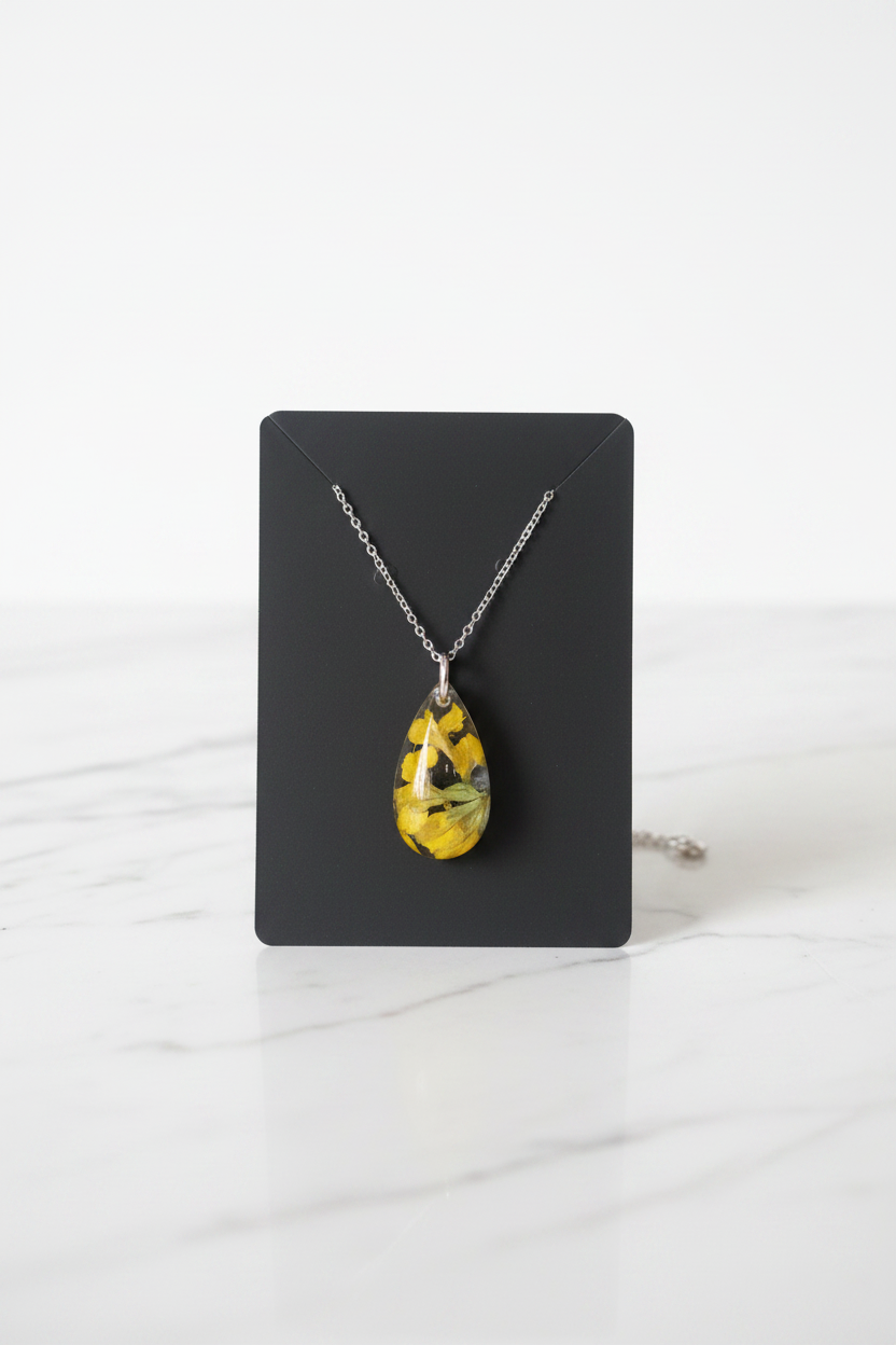 Yellow Teardrop Necklace on White Marble